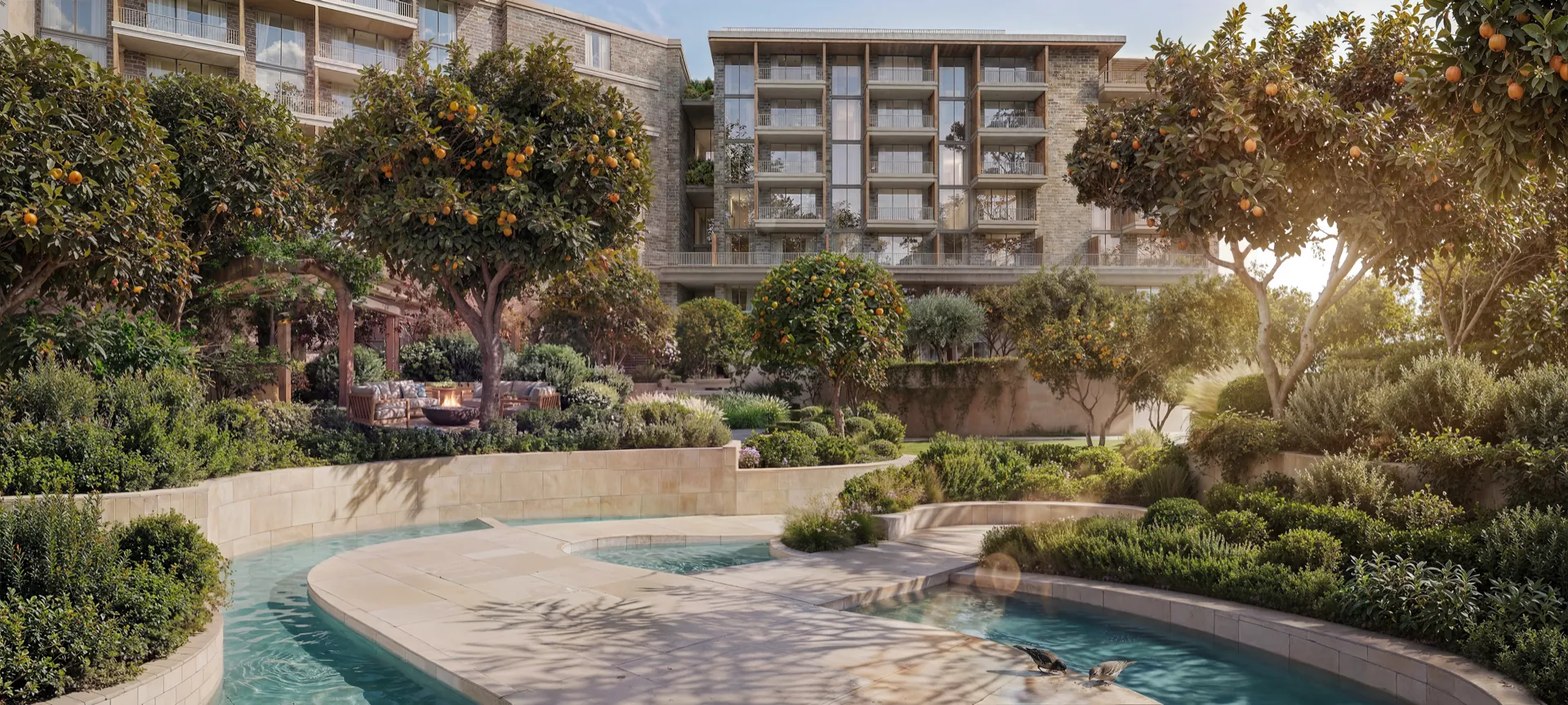 Cascading water feature and pool in a landscaped courtyard at Melograno Yards by Beyond